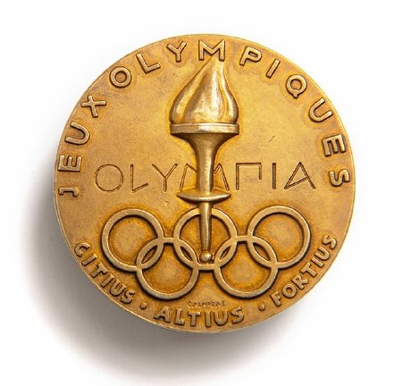 Back: Stockholm 1956 prize medals, torch set in Olympic rings and legend