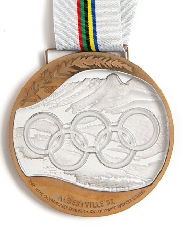 Front: Albertville 1992 bronze medal, Olympic rings over alpine landscape