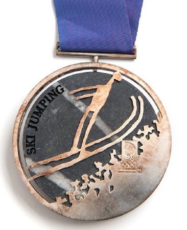 Back: Lillehammer silver medal, ski jumping pictogram and Games emblem